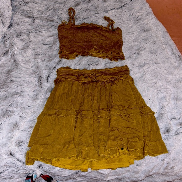 Two piece set. Skirt+croptop Color:Burnt yellowish/fall color. Brand: Listicle. - Picture 1 of 4